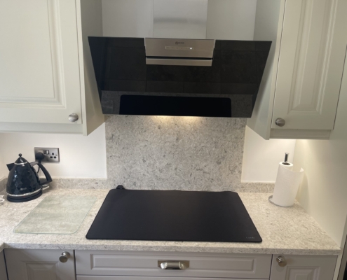 Jefferson cashmere kitchen with Fugen Irini quartz worktops, induction hob and extractor hood